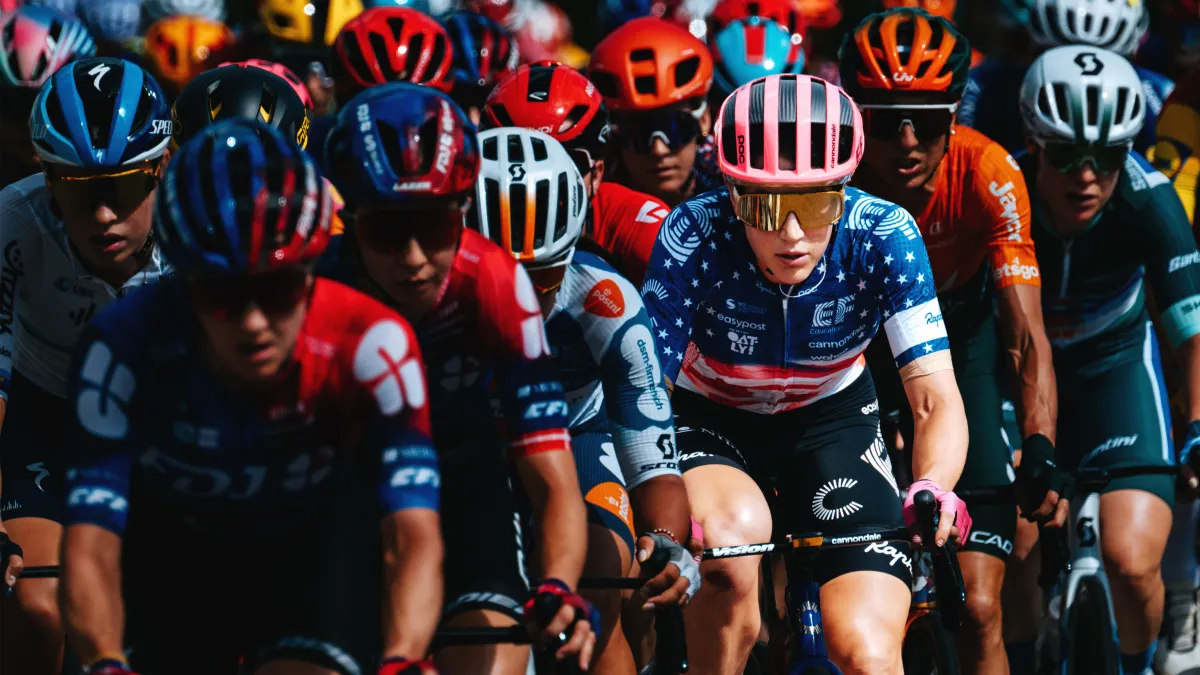 Kristen Faulkner looking straight ahead in competitive cycling race.