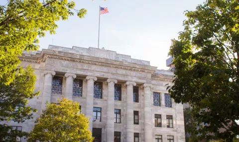 Photo of Harvard Medical School building that is white with six columns in front