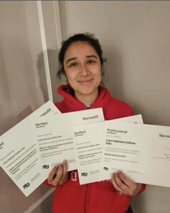 Learner holding four certificates