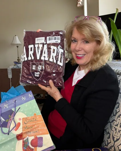 Rebecca Barnett poses with the sweatshirt she received as a gift from her husband.